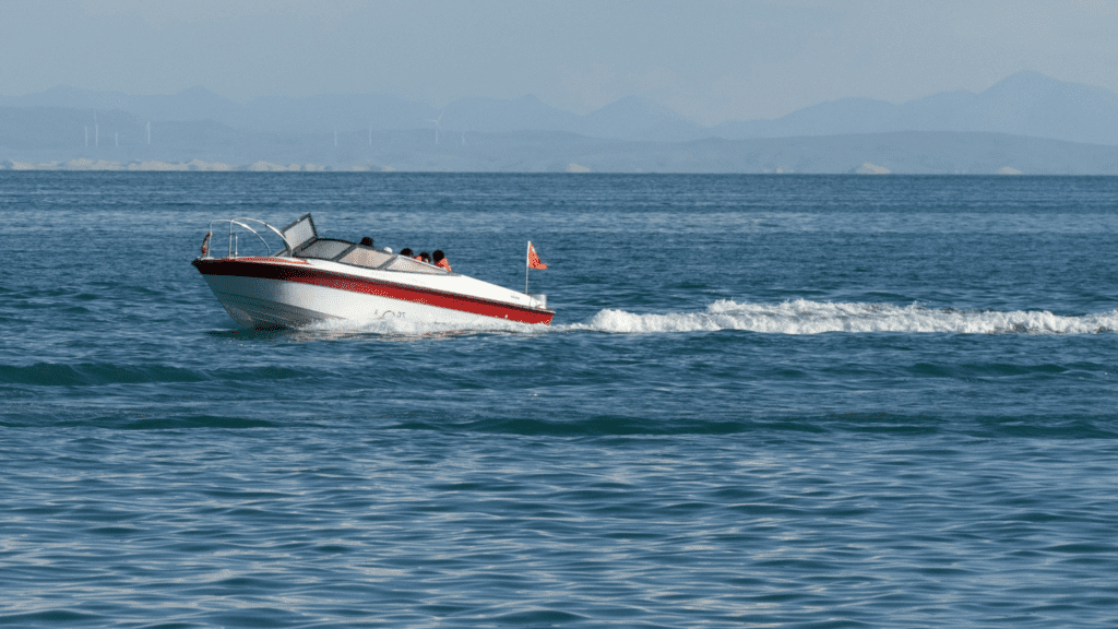 fast moving open top boat in the water