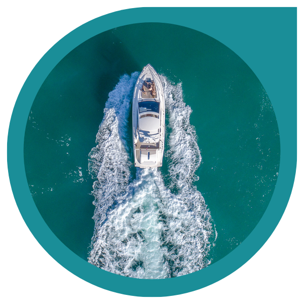 birdseye view of a motor yacht cruising through the water