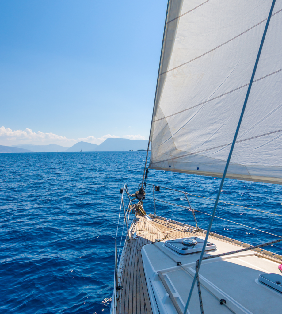 View from the front of a sailing boat on the ocean